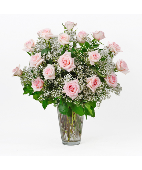 Valentine's Day Twenty Four Pink Roses and baby's breath flowers in a clear glass vase by Freytag's Florist