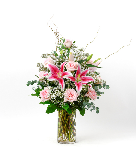 Valentine's Day One Dozen Pink Roses and baby's breath flowers in a clear glass vase by Freytag's Florist