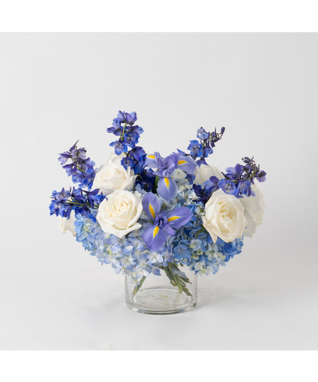 Celebrate the beauty of Hanukkah with the Love and Faith arrangement, a striking design that radiates serenity and elegance. 