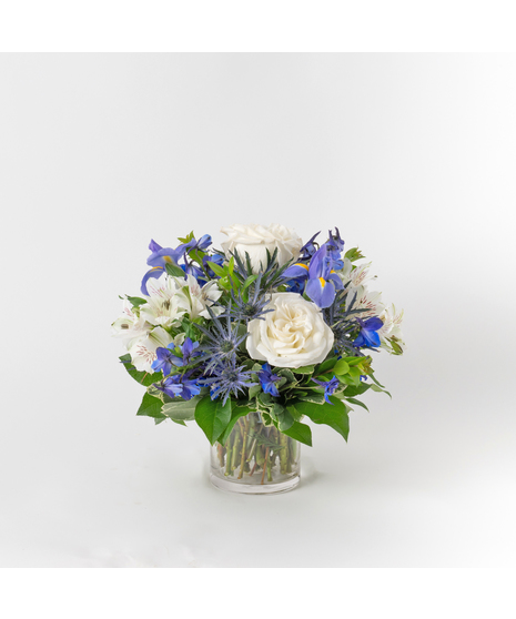 Celebrate the beauty of Hanukkah with the Peaceful Night arrangement, a serene and elegant display of blooms in a 4-inch glass vase.