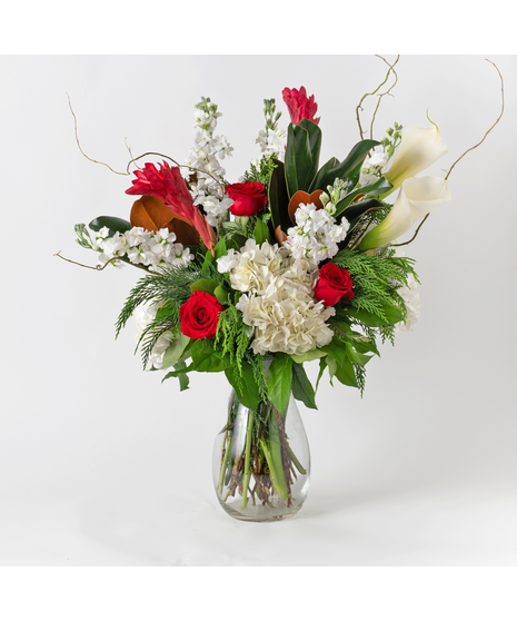 Make your holiday moments unforgettable with our Under Mistletoe arrangement.